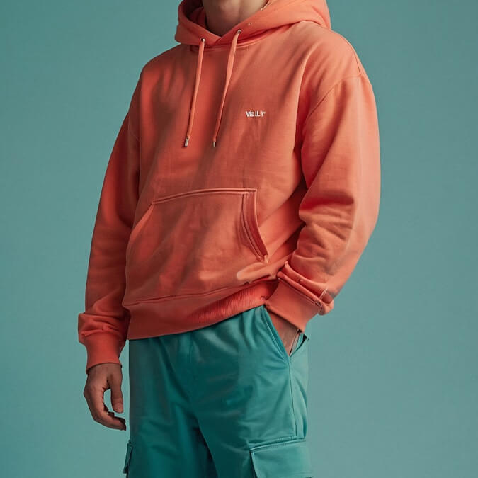 Young Man in Orange Hoodie Core Vibe